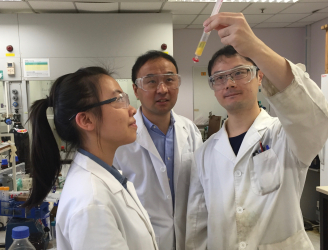 Dr Xuechen Li working in the laboratory with his research team.